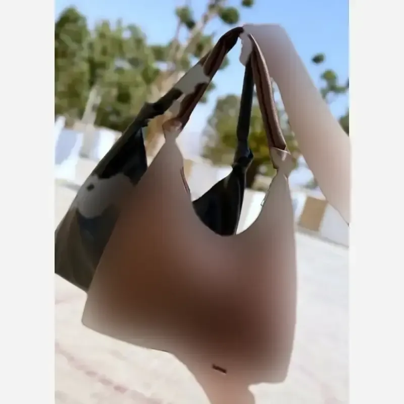کیف بغل گره چرم شرانگ به همراه کیف لوازم آرایش رنگ مشکی و شکلاتی