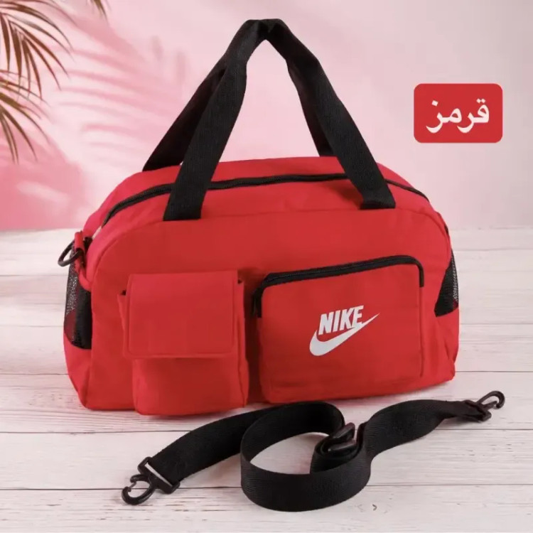 ساک ورزشی و اسپرت پارچه ای دارای بند بلند و 5 جیب بیرونی با بسته شدن زیپ